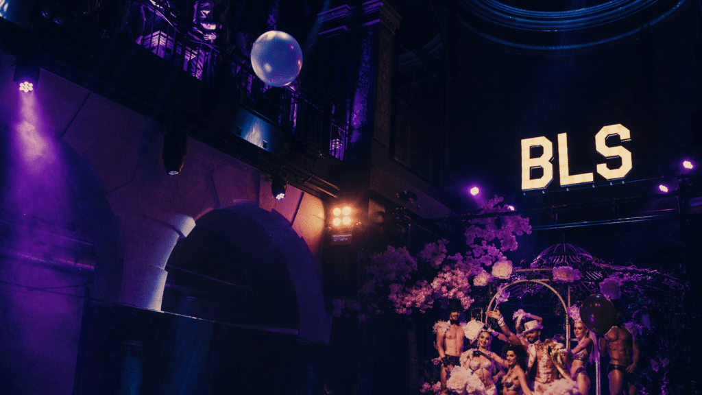 Big Little Secrets party in Amsterdam with dance floor and illuminated BLS logo