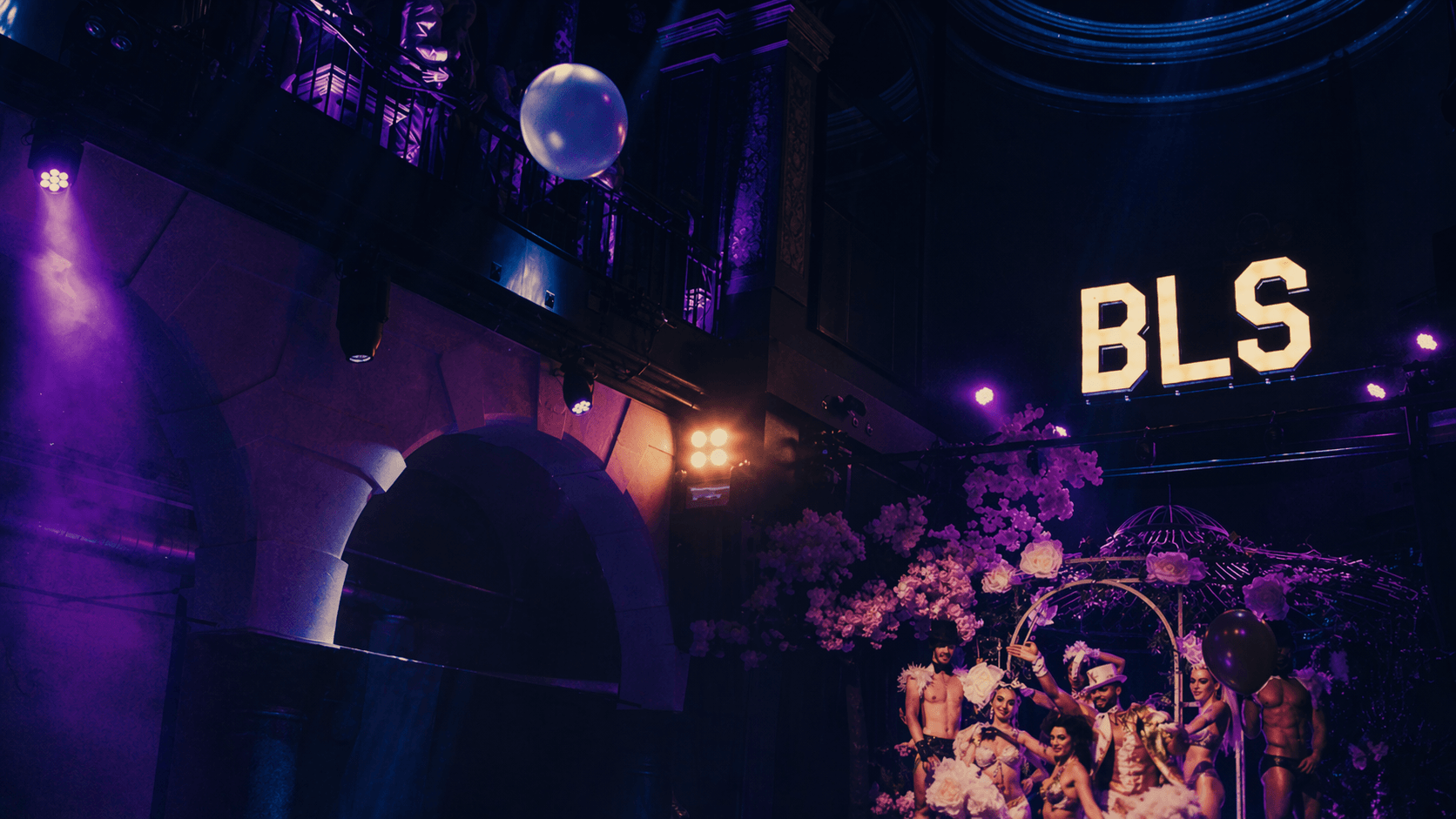 Big Little Secrets party in Amsterdam with dance floor and illuminated BLS logo