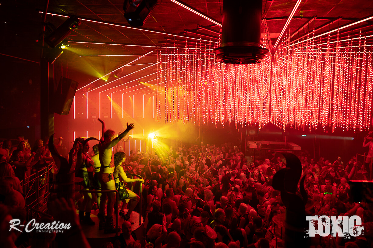 Toxic Fetish Festival Brabant Audience dances under red laser lights