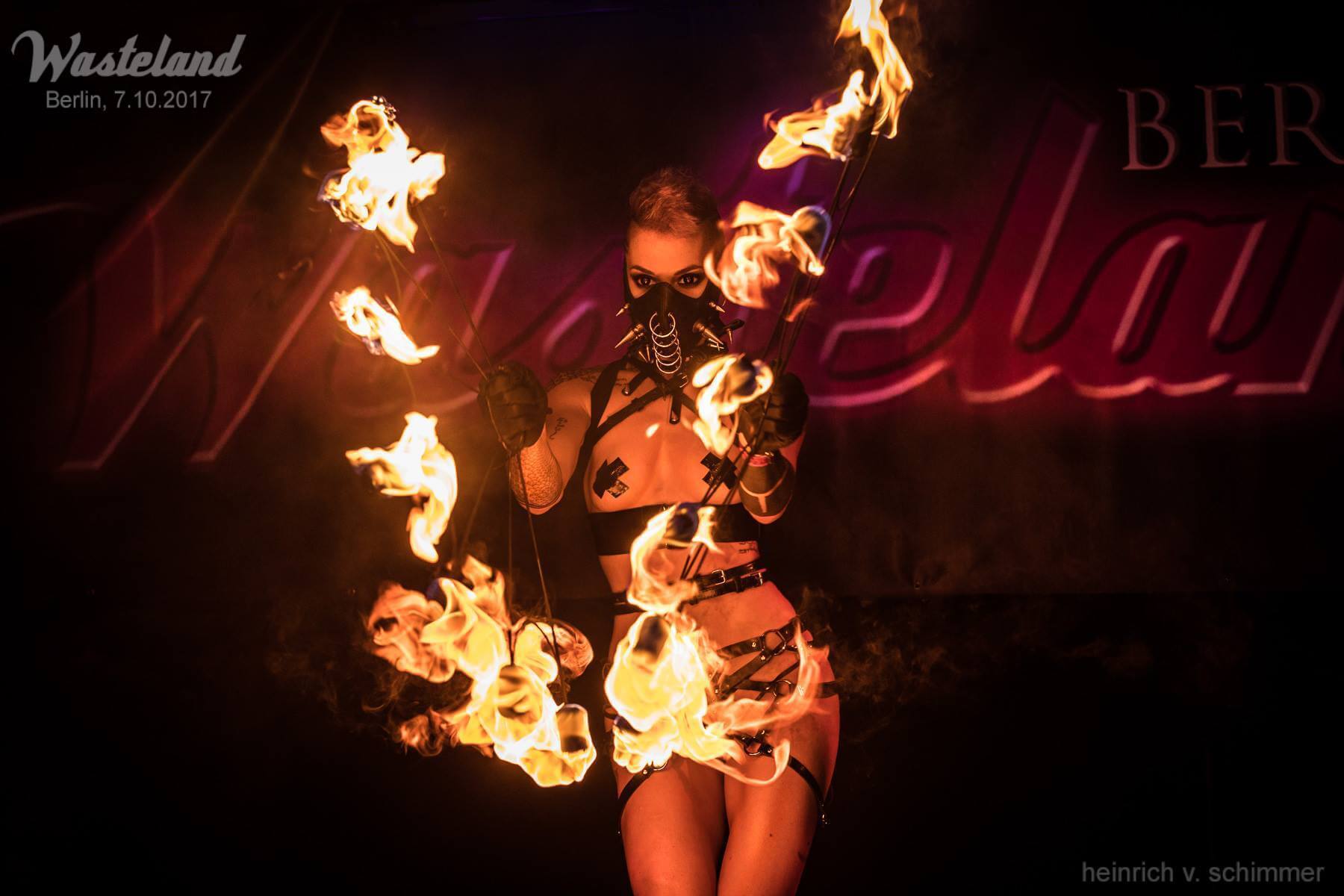 a show at a fetish party — fire breathers and entertainment on the dance floor